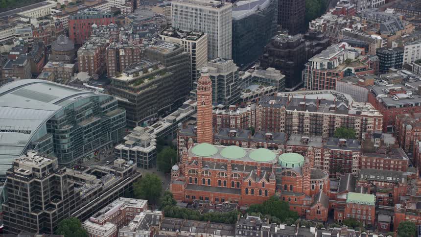 A neighborhood in a metropolitan city with several tall and old buildings