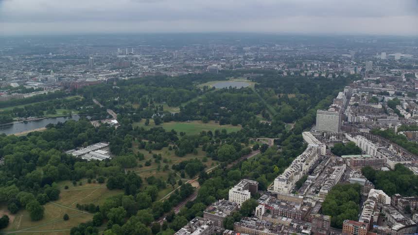 Aerial view of a city with houses buildings and wooded areas