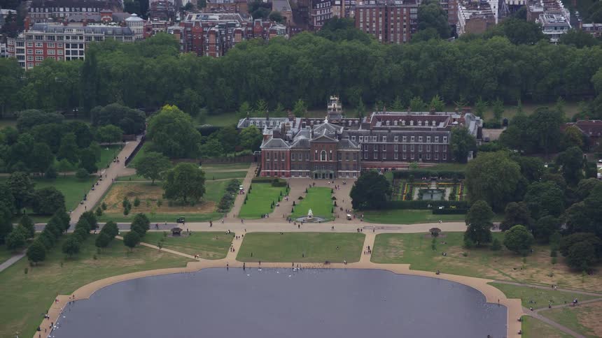 Aerial view of a building in a sub urban area with lots of trees
