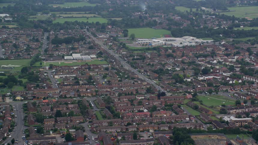 Traffic moves through the streets of a residential neighborhood