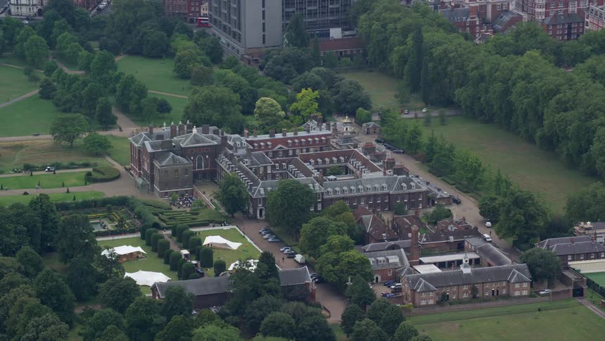 Aerial view of a hotel amidst a green area in the city center