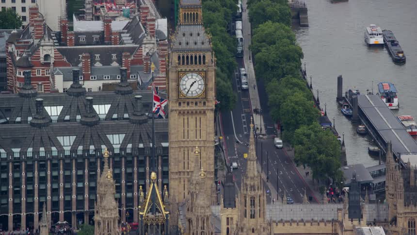 Aerial view of a clock tower by the seaside in a city