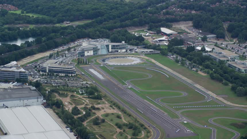 Aerial view of an airport runway and parking lot
