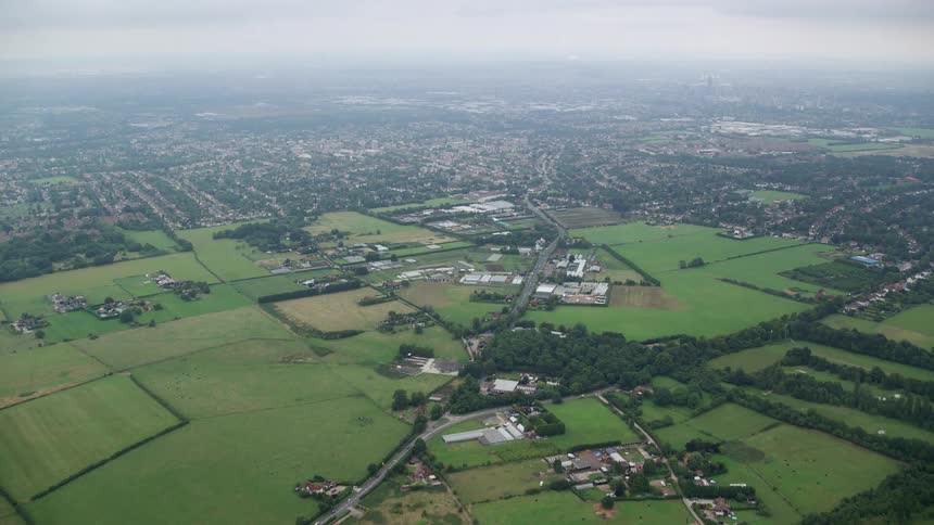 Aerial of a rural city with a football field