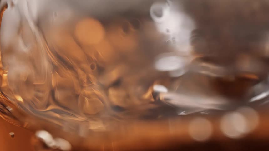 Shining oily liquid and small droplets