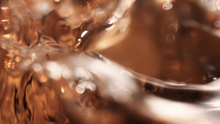Clear water waves splash around in slow motion