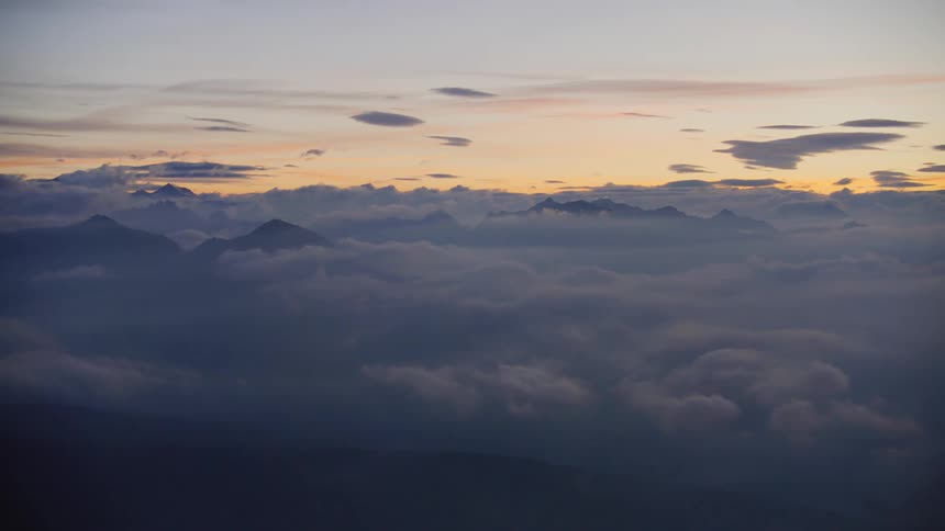 Aerial view of the sky clouds and mountain peaks