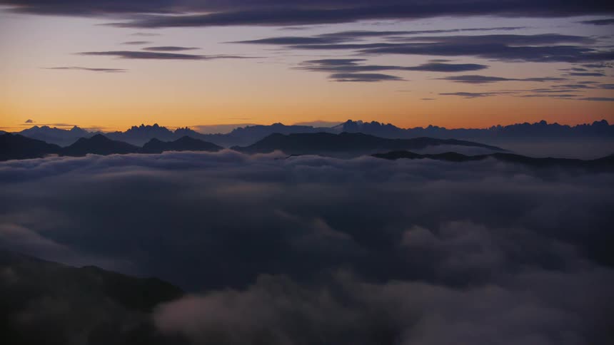 The sun is rising on the mountains