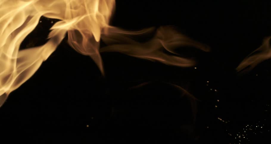 Sparks of fire and a flame heading towards the right