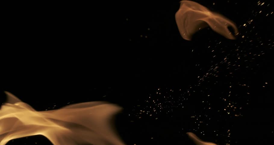 Sparks of fire and a flame heading towards the right