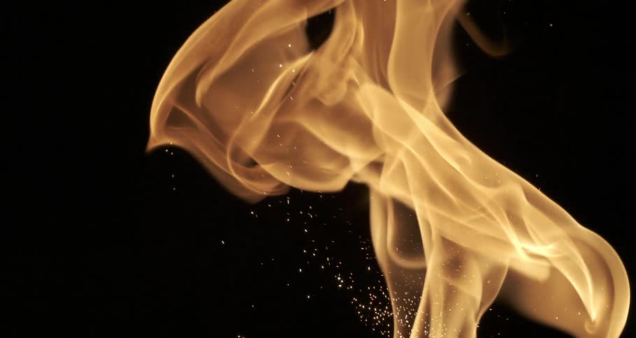 Bonfire flames glowing in the dark night