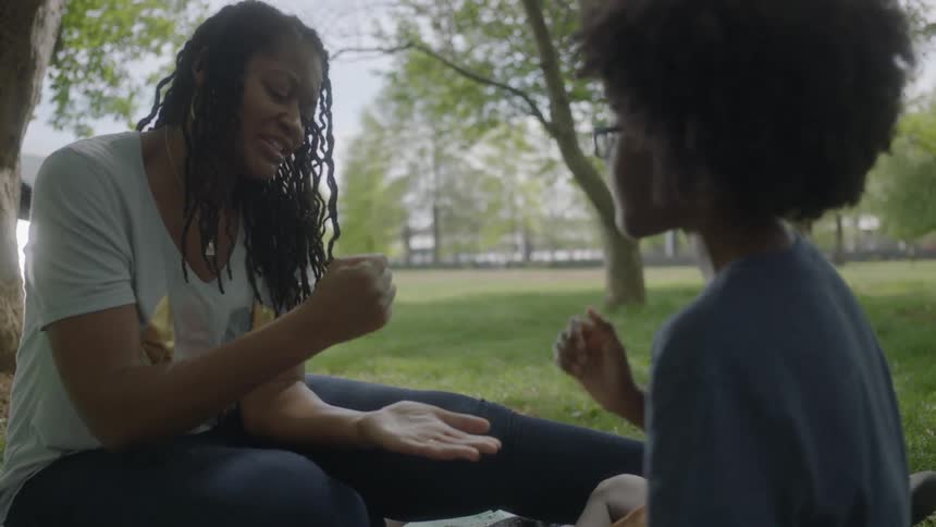 A woman and child play games together