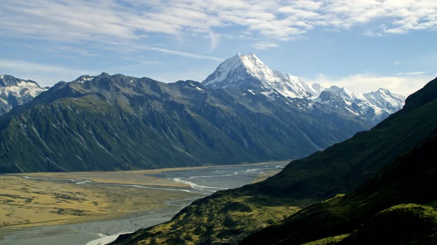 Dramatic aerial reveal of the Mt Cook mountain with snow on the peak in New Zealand