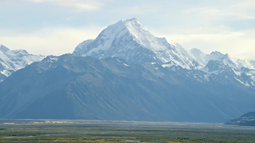 A massive mountain with snow on it