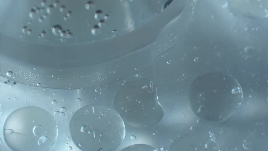 Water bubbles floating in a clear liquid
