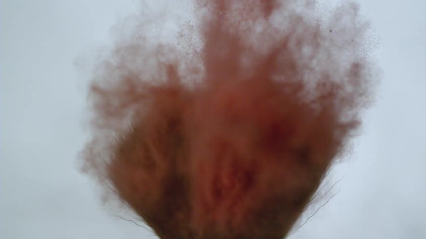 Extreme closeup of a makeup accessory with brown foundation powder
