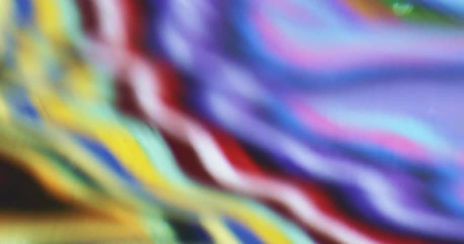 Reflection of shiny vibrant colors in water waves