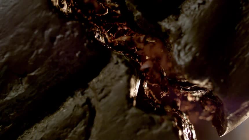 Chocolate candy bar cracks and creates falling crumbs