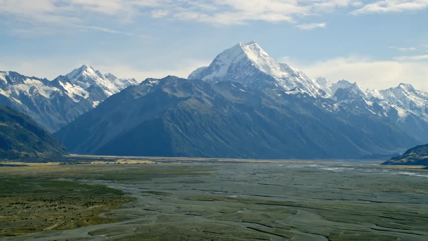 Mountains tower the riverbed