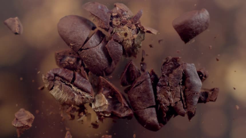 Toasted coffee beans breaking into pieces