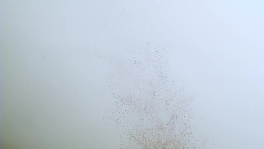 Make up brush spilling out red powder