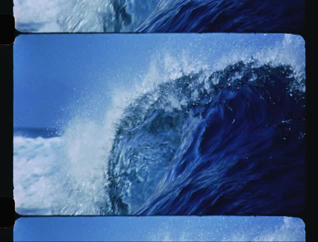 A blue sea wave breaking and making a tube