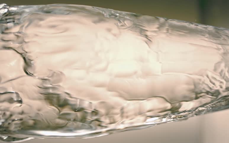 Dense and abstract liquid in motion