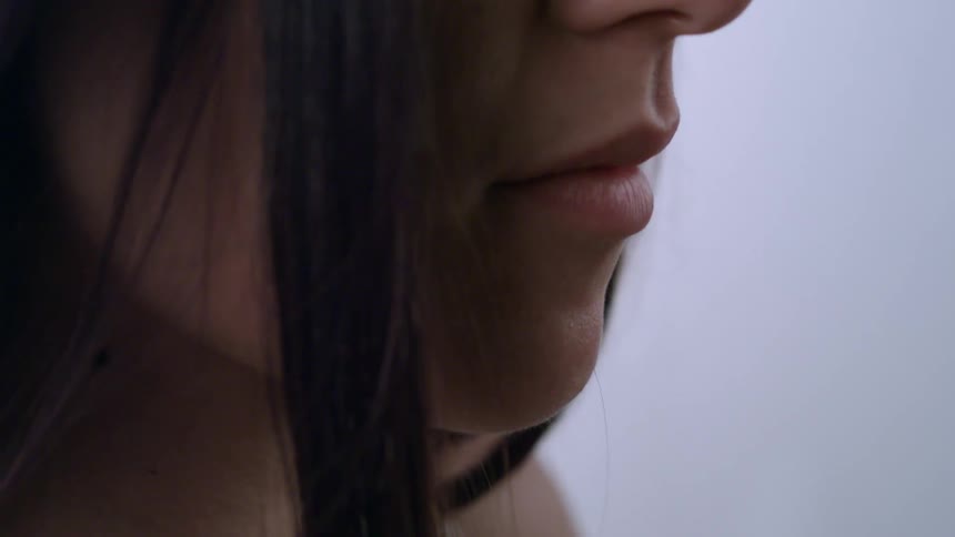 Young woman with long hair and full lips