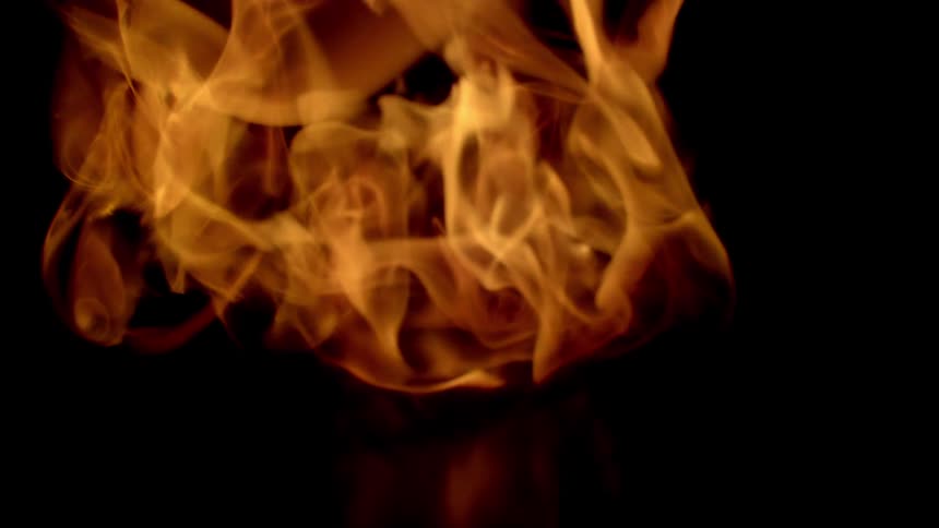 A flame of fire on a black background