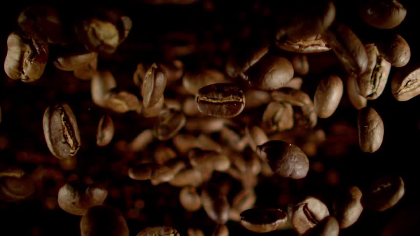 Several grains of coffee falling together