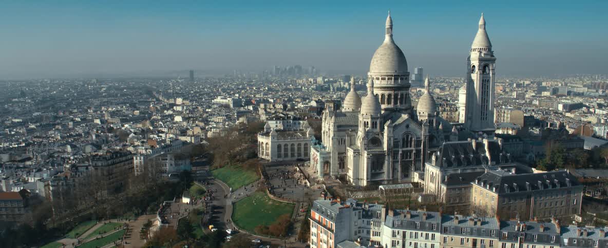 A large church is on a hill by the city