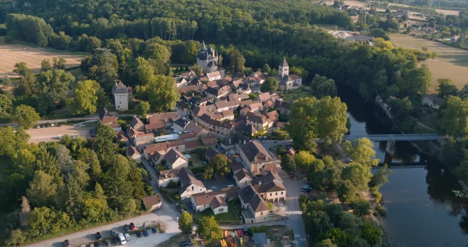 A small village with ancient architecture next to a river