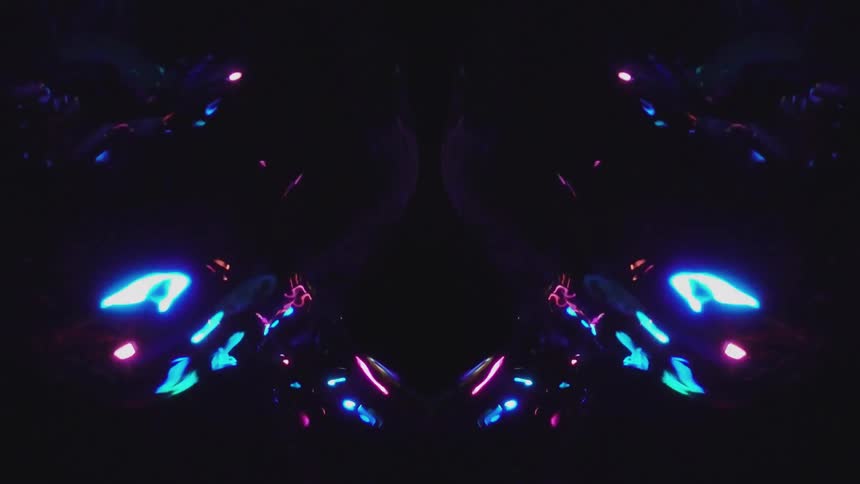 Mirrored bubbles with neon lighting on black background