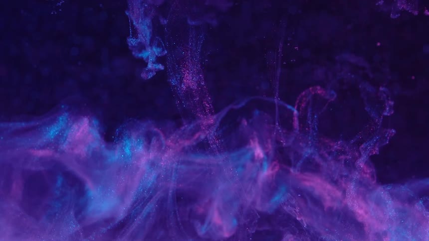Floating cloud of abstract liquid metallic inks with neon colors