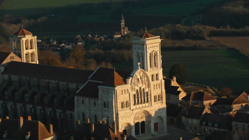 An ancient monastery with a tower in a small rural village