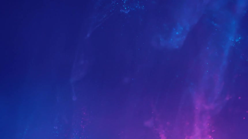 Cloud of neon colored metallic particles falling down