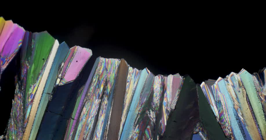 Microscopic view of colorful Erythritol crystals forming