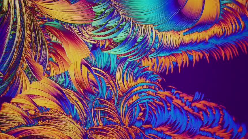 Colorful crystals growing and forming abstract shapes under microscope