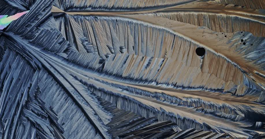 Microscopic view of sulfur crystals forming