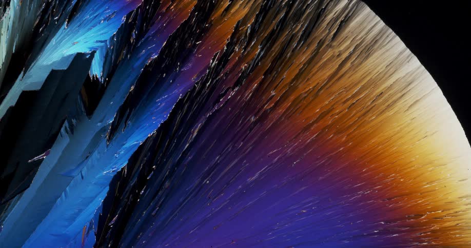 Growing colorful crystals forming under a microscopic small view