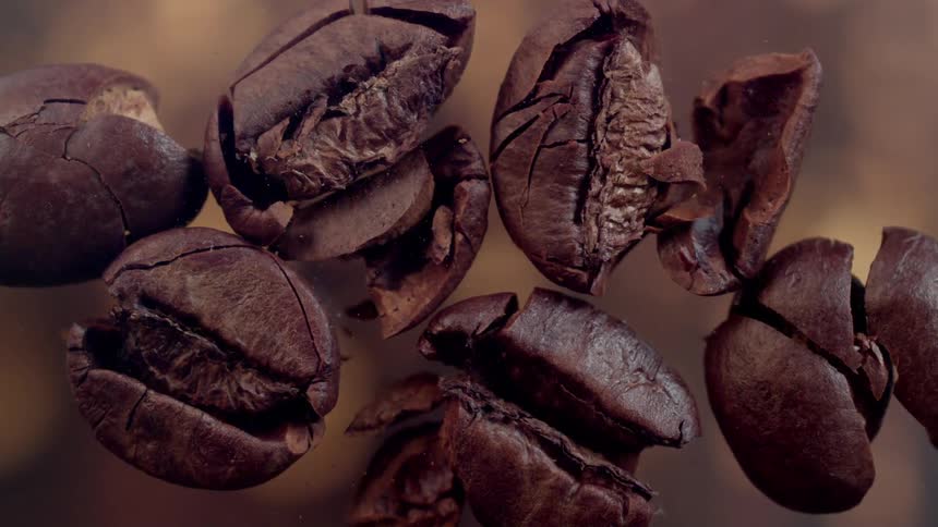 Roasted coffee beans falling
