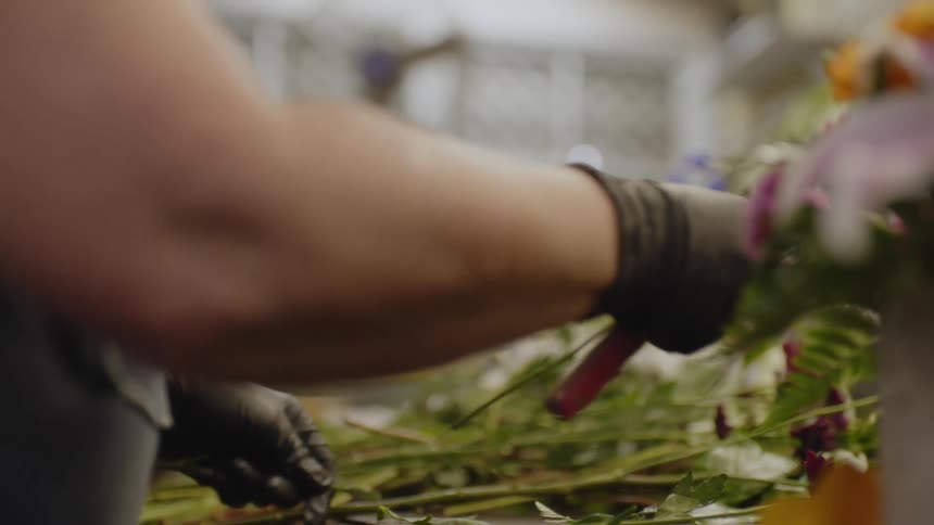 A woman is working in the flower shop