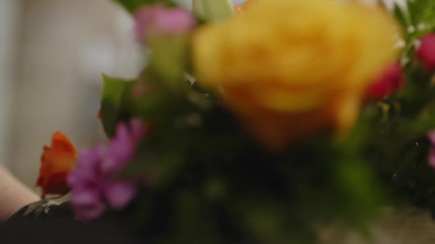 Arrangement of flowers being rotated