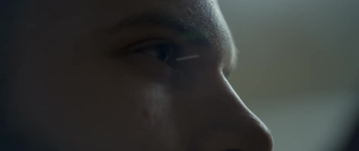 A male human face with reflections at the extremities