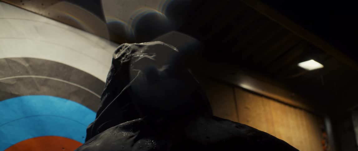 Back of the head of a man wearing a wet hoodie