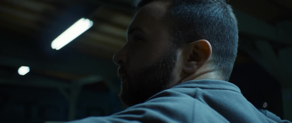 A bearded practicing his archery skills at night