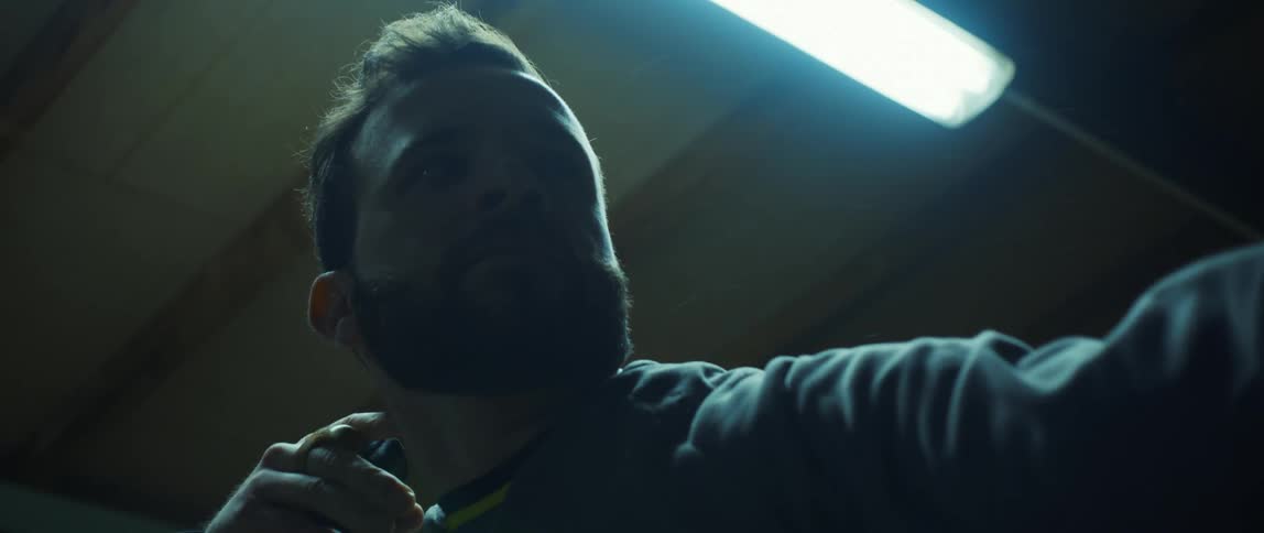Portrait of a man releasing an arrow