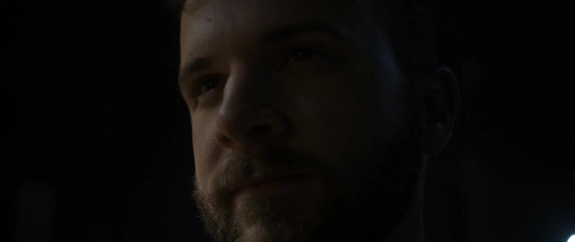 A man deep in thought at night