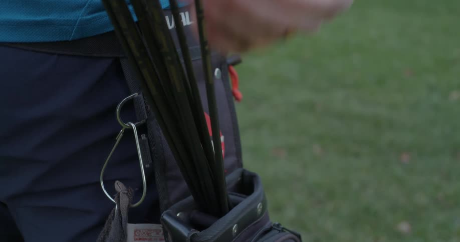 Person draws an arrow from its pack