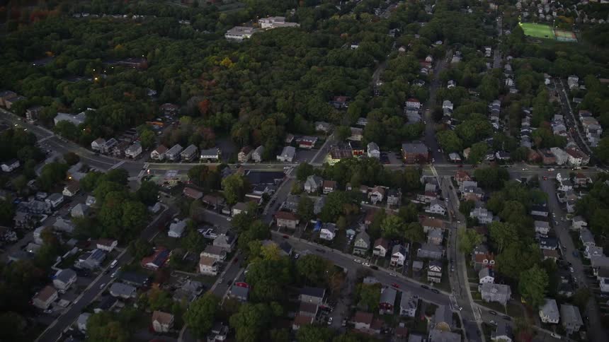 Traffic moves through residential neighborhood surrounding sportsfield